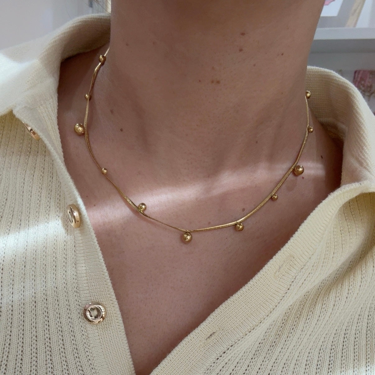 Collar Bolitas Planchado