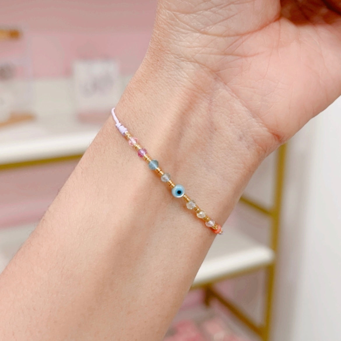 Pulsera ojitos cristalitos lila